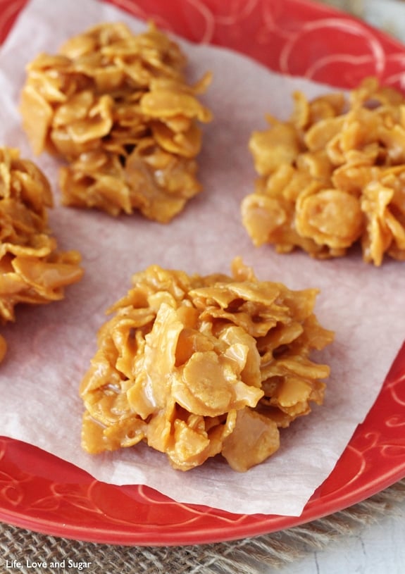 close up image of Caramel Cluster Cookies on red plate