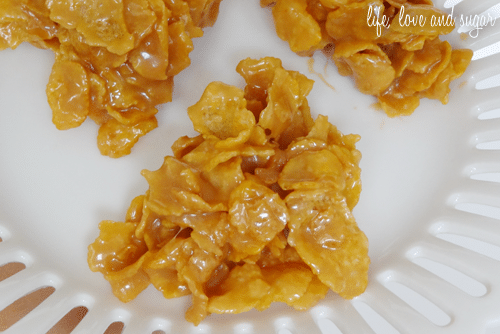 close up image of caramel clusters on a white cake stand