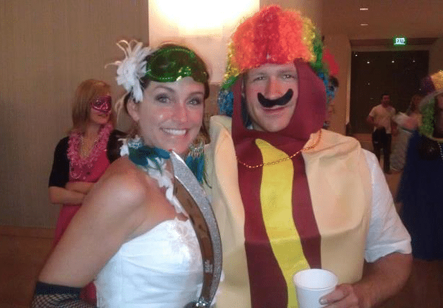 Janelle and Jeff Dressed in Costumes with Jeff as a Hot Dog Clown