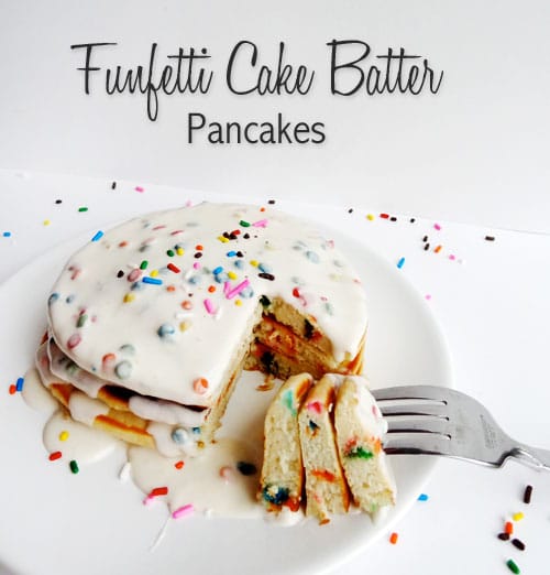 A stack of Funfetti Pancakes with a fork taking a bite out