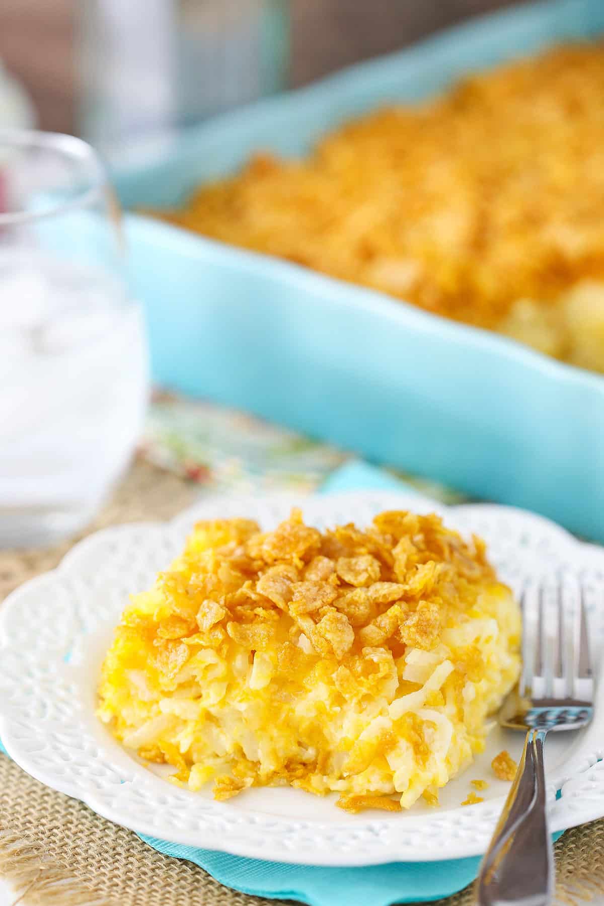 Serving of hashbrown casserole with cheddar cheese.