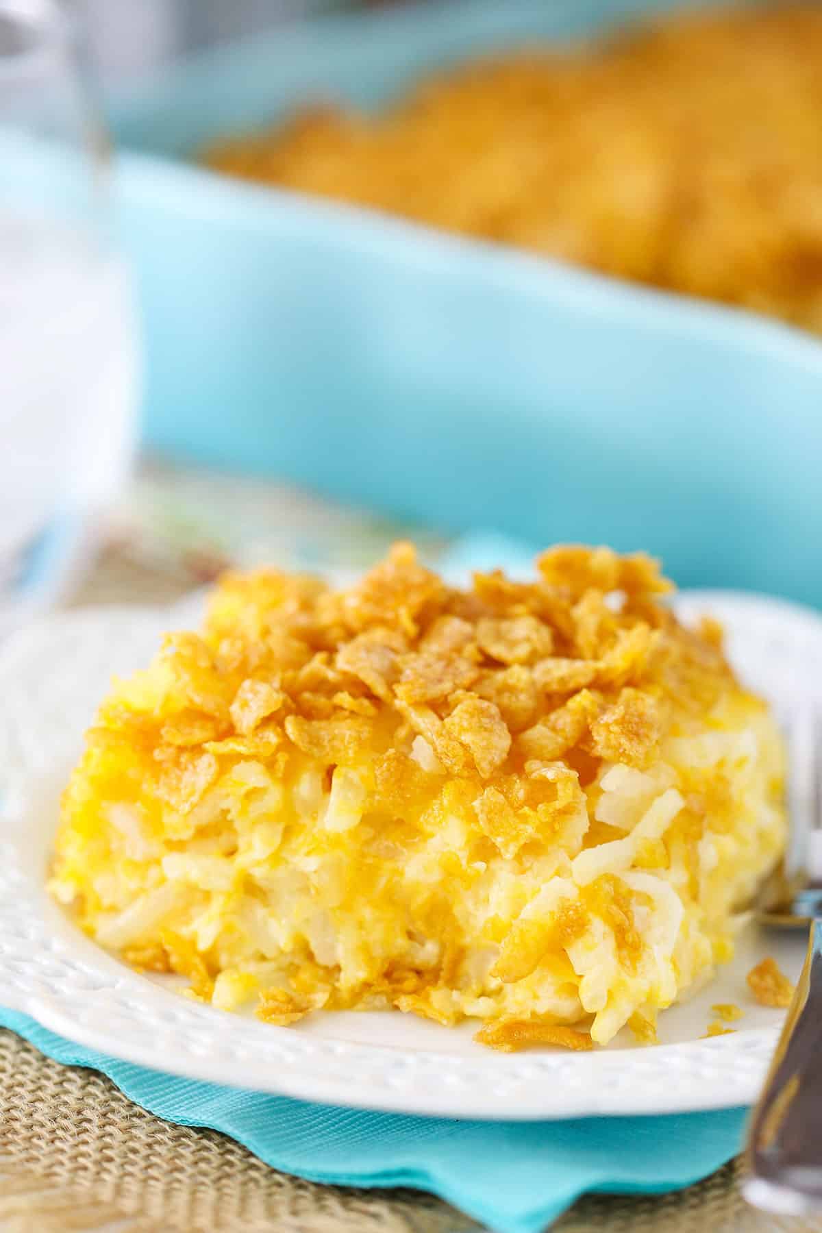 Cheesy hashbrown casserole with a crushed cornflake topping.