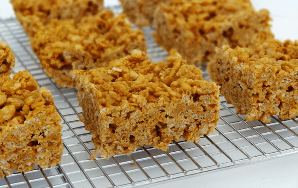 Pumpkin Butterscotch Rice Krispie Treat squares on a wire rack