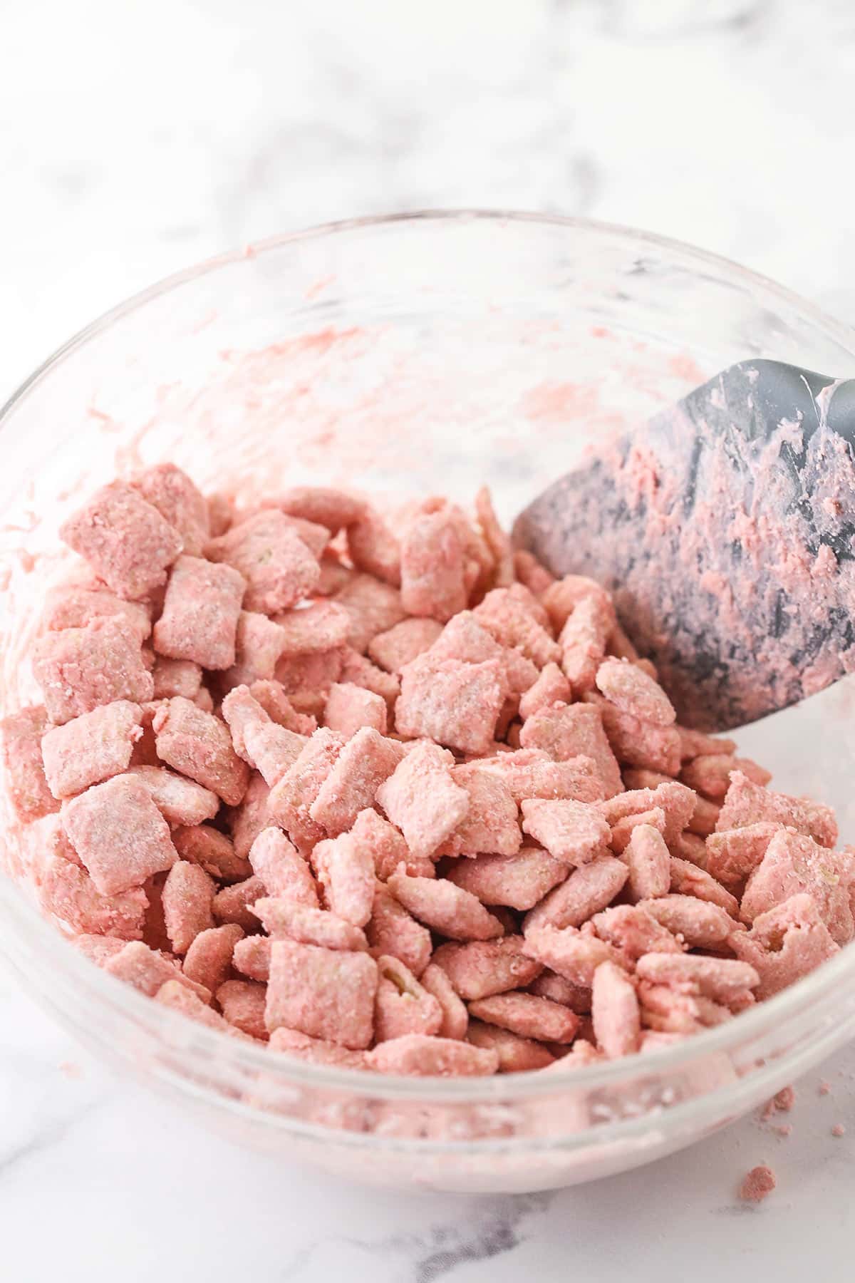 pink puppy chow in glass bowl