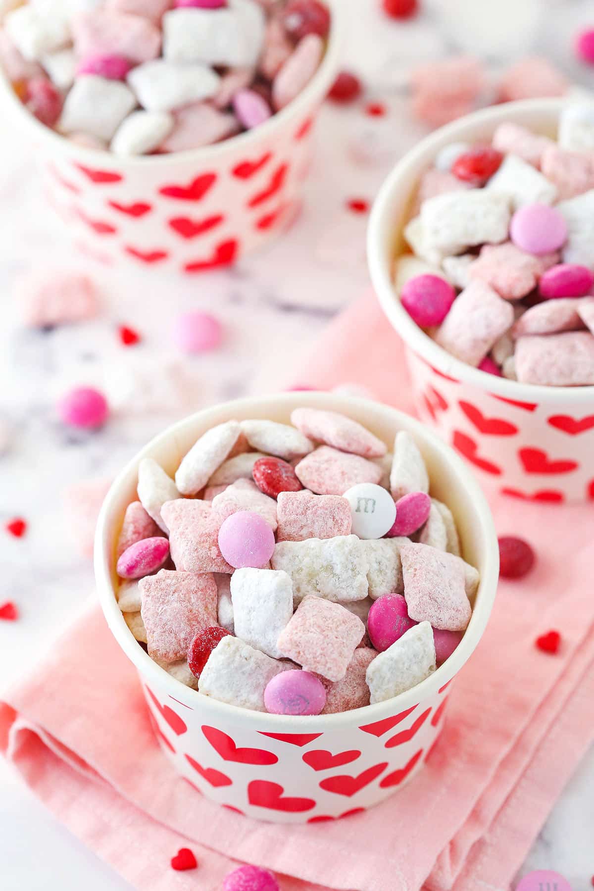 pink and white puppy chow in individual heart cups