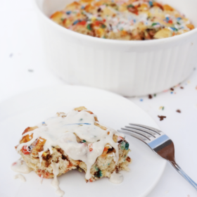 Funfetti Cake Batter Cinnamon Roll Casserole {with Rainbow Chip Icing} with casserole in background