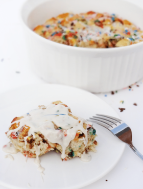 Funfetti Cake Batter Cinnamon Roll Casserole {with Rainbow Chip Icing} with casserole in background