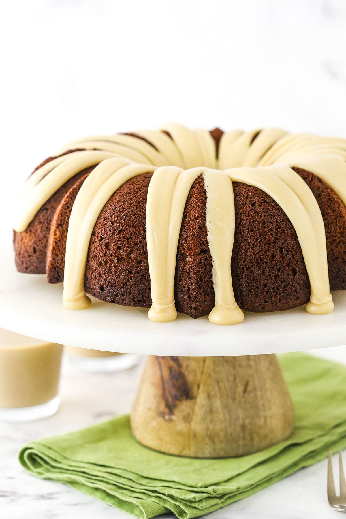 Baileys Irish Cream Bundt Cake on marble and wood cake stand