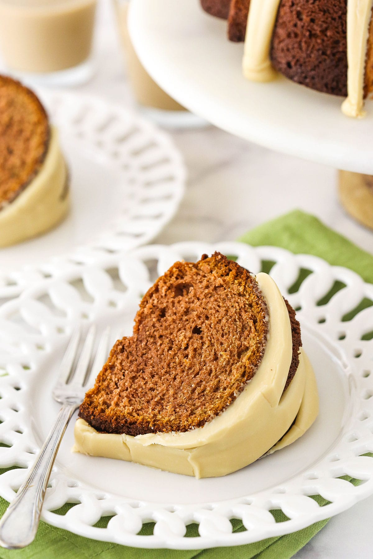 slice of Baileys Irish Cream Bundt Cake on white plate with a fork