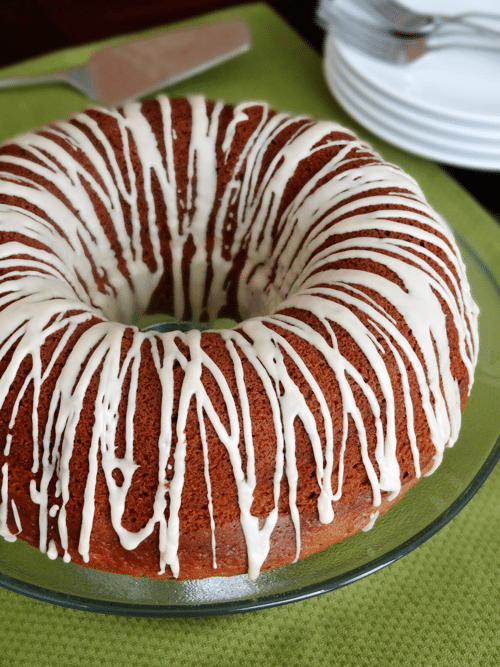 Top view of a Bailey's Irish Cream Cake on glass plate close up