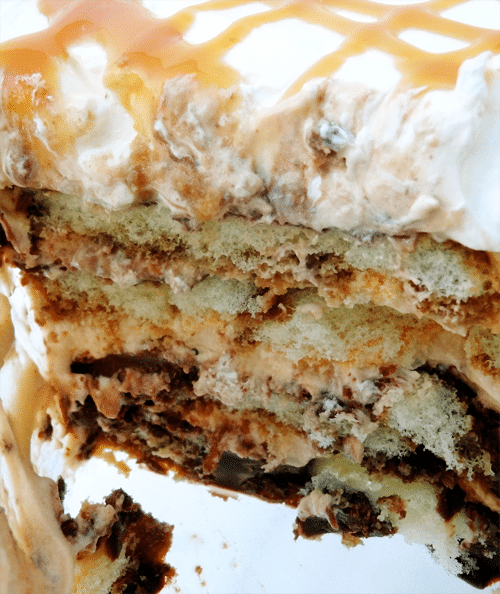 A piece of Caramel Macchiato Tiramisu with whipped cream on top