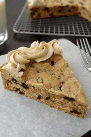 Thick and Chewy Oatmeal Raisin Cookie Cake With Cinnamon Maple Icing slice