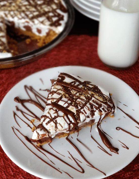 Top view of a slice of Nutella, Peanut Butter and Marshmallow Pie on a white plate