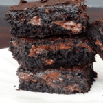 Brownies stacked on white plate