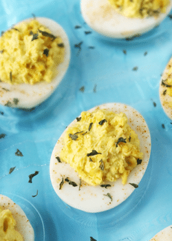Traditional Deviled Eggs on blue plate