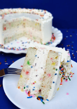 Funfetti Cake Batter Ice Cream Cake slice on white plate