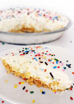 Funfetti Cake Batter Ice Cream Cake slice on white plate