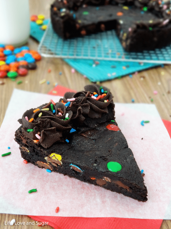 A big slice of Triple Chocolate Cookie Cake on paper