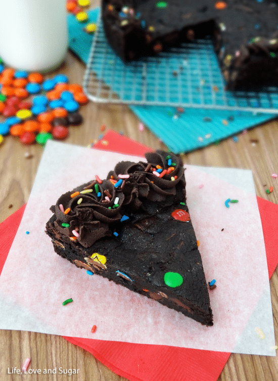 A slice of Chocolate Cookie Cake on parchment paper