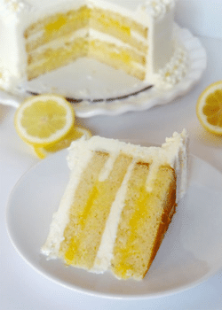 Triple Lemon Cake slice on white plate