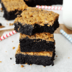 Fudgy Brownies with Crispy Butterfinger Crust stacked
