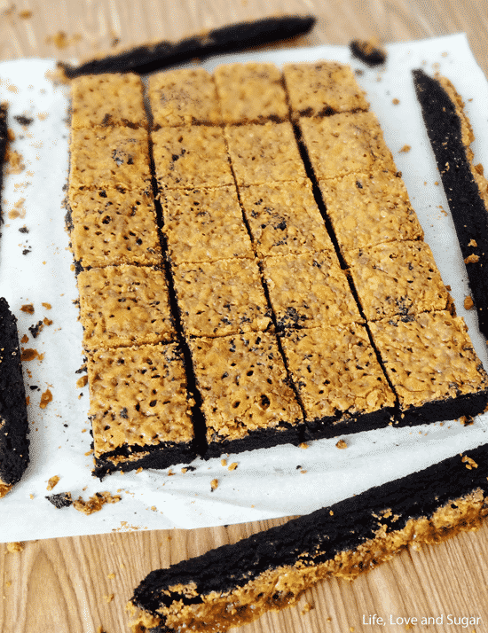 A batch of brownies with with Butterfinger crust sliced into pieces