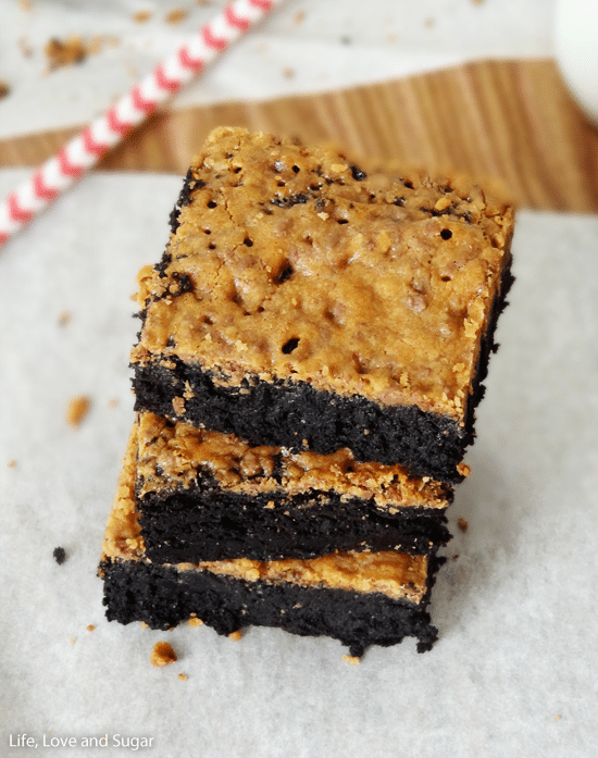 Top view of three fudgy brownies stacked on top of each other