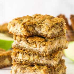 A stack of apple cheesecake oatmeal cookie bars