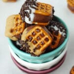 Chocolate Covered Nutella Pretzel Bites in stacked cups