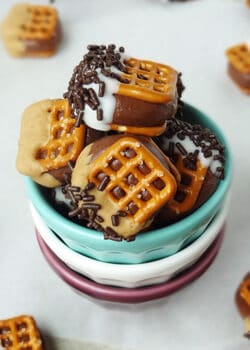 Chocolate Covered Nutella Pretzel Bites in stacked cups