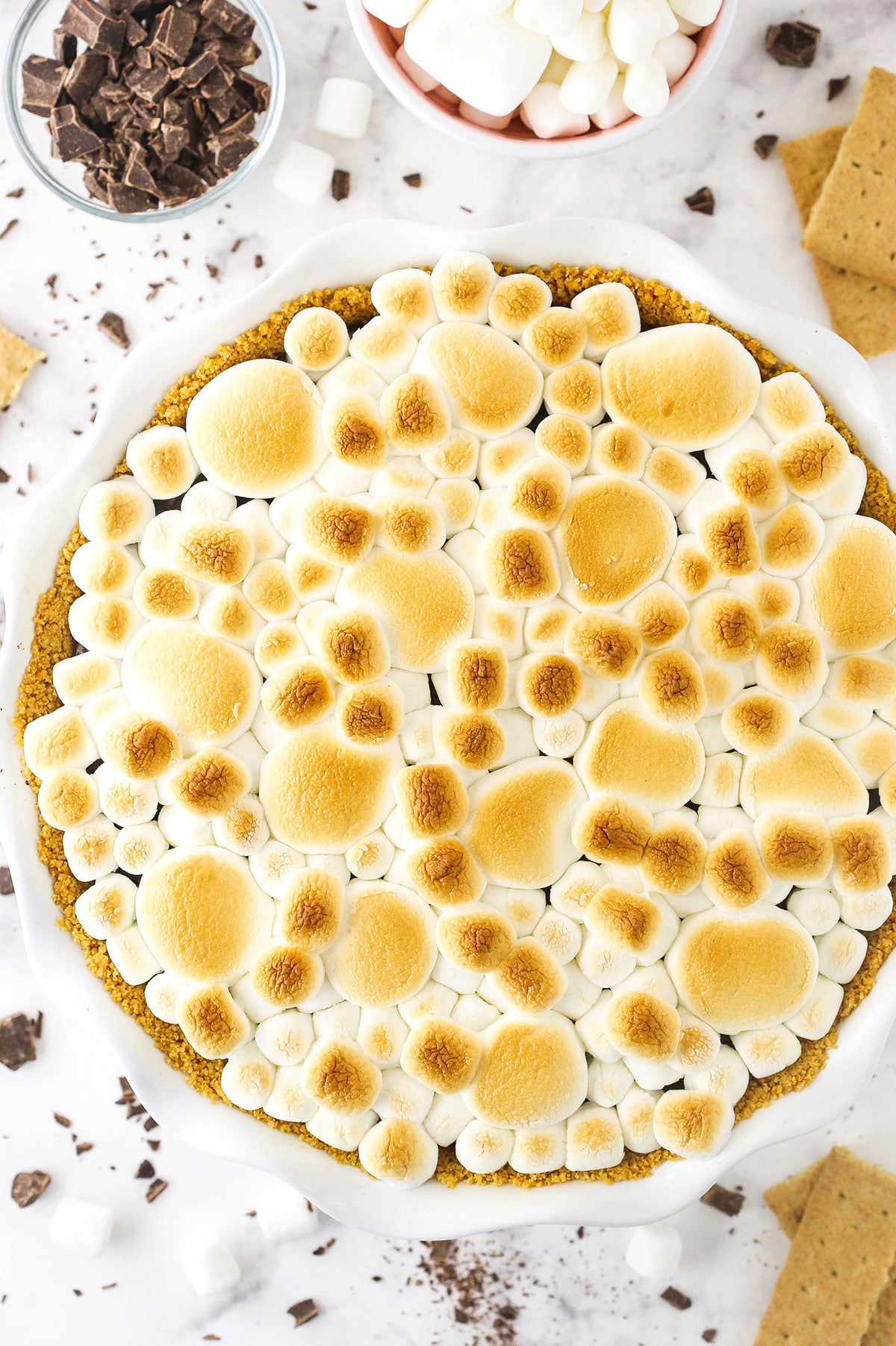 Top view of a smore's chocolate pie with marshmallows and chocolate