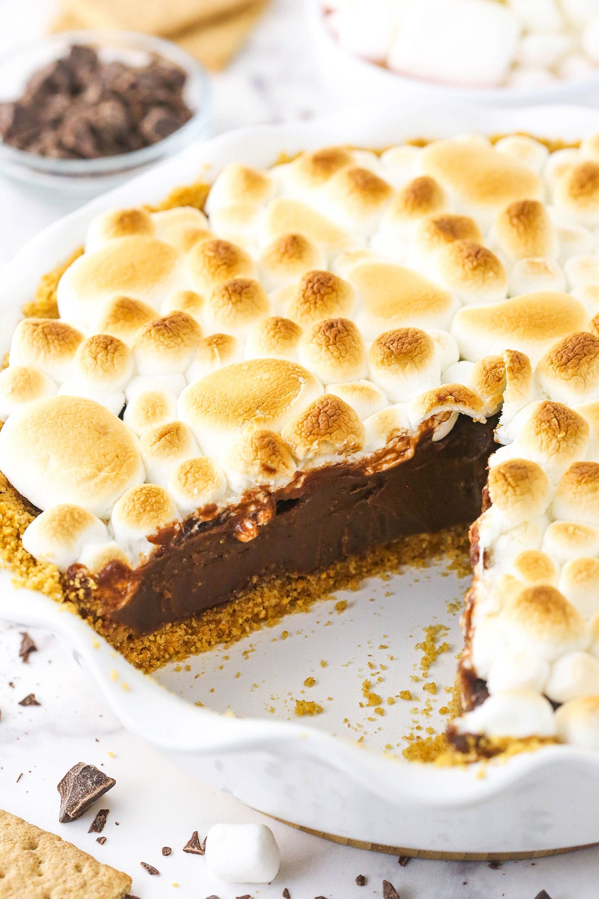 Smore's chocolate pie with a slice taken out so you can see the inside of the pie.