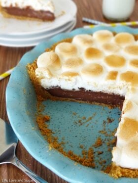 Smores Chocolate Pie slice in blue pie plate