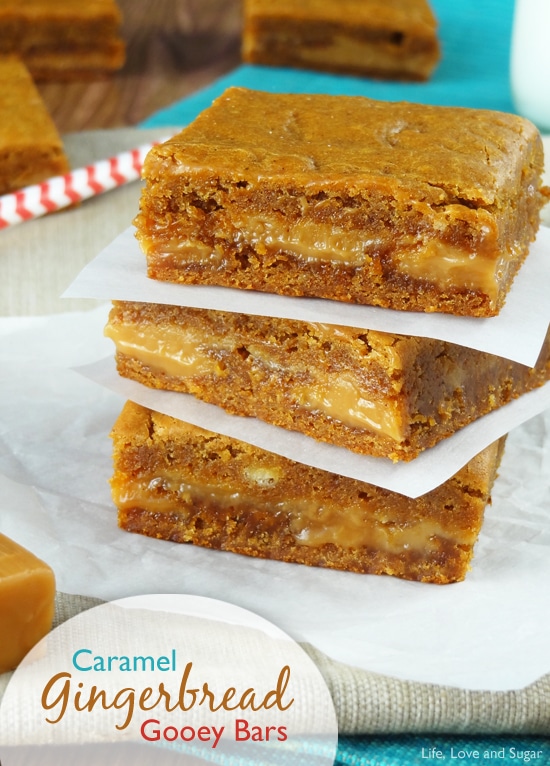 Gingerbread Caramel Gooey Bars stacked on wax paper