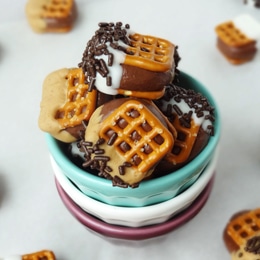 Chocolate Covered Nutella Pretzel Bites in stacked cups