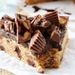 Reese's Peanut Butter Chocolate Chip Cookie Cake slice on waxed paper close up