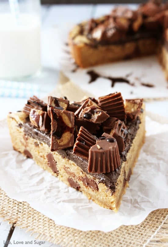 Reese's Peanut Butter Chocolate Chip Cookie Cake slice on parchment