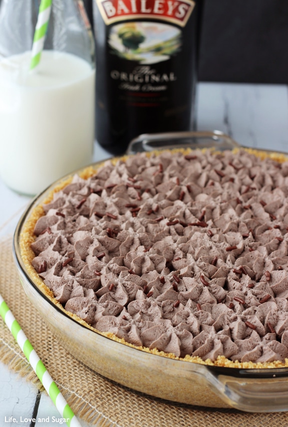 A Chocolate Pie in a glass baking dish with chocolate whipped cream on top