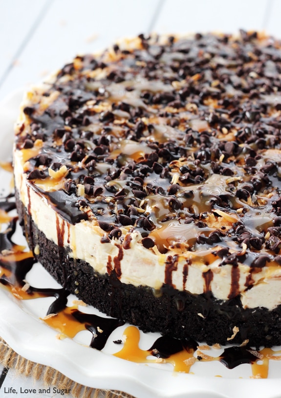 A No-Bake Samoa Cheesecake Topped with Chocolate and Caramel Sauce