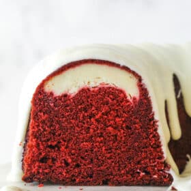 The end of a red velvet cheesecake swirl bundt cake