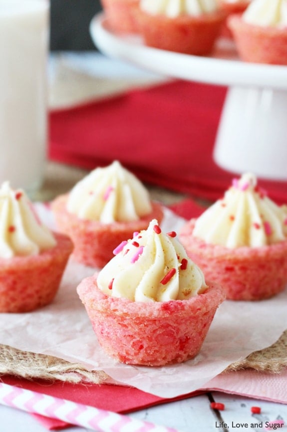 A close up of a Strawberry Cheesecake Cookie Cup with red sprinkles 