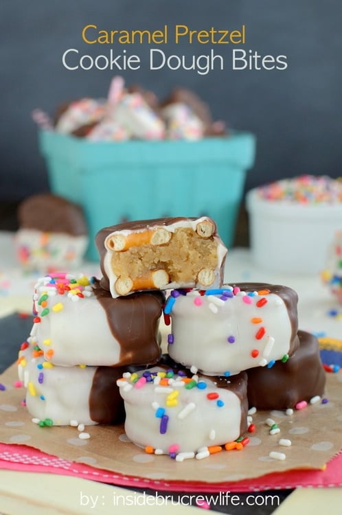 Close up of a stack of Caramel Pretzel Cookie Dough Bites with the top one broken to show the center.