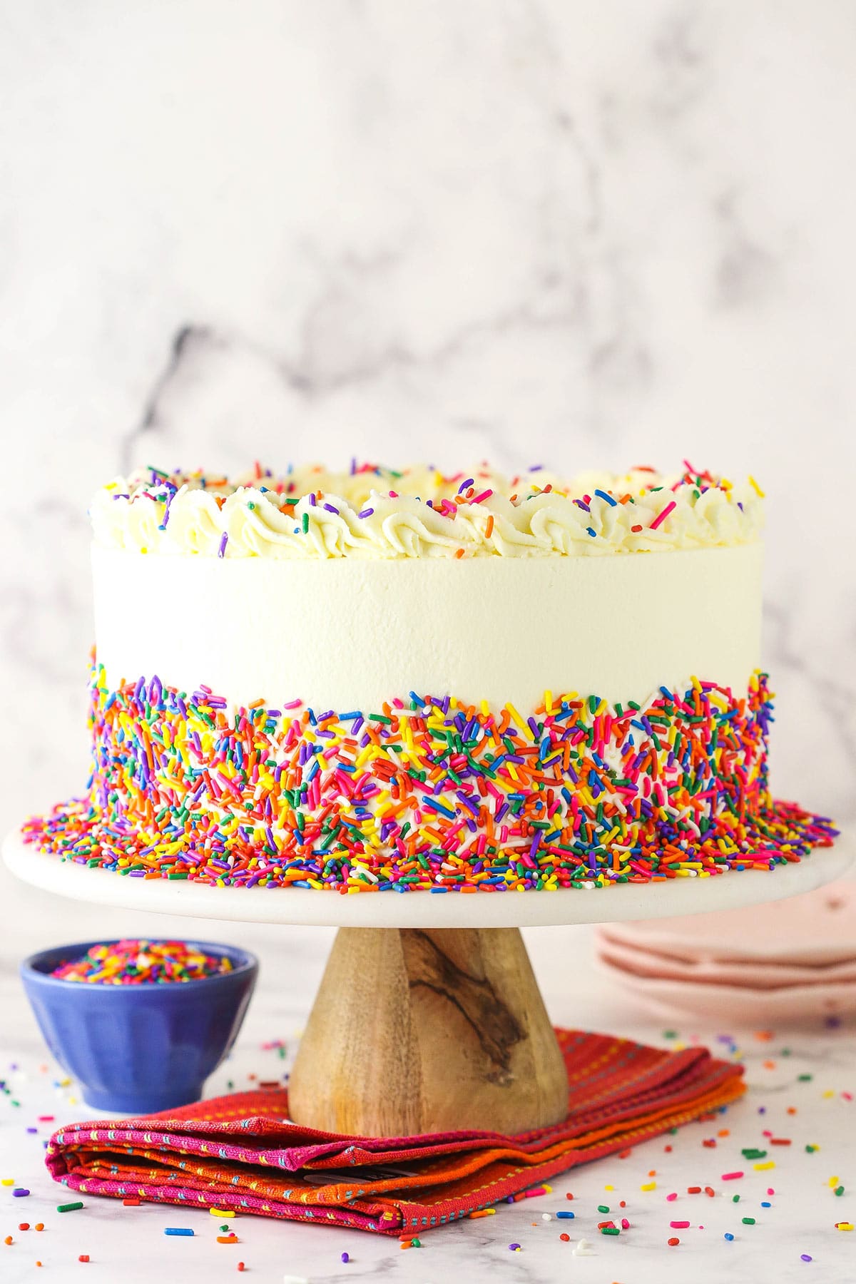 Funfetti millionaire cake on a cake serving stool