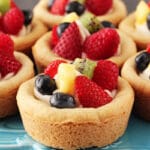 Fruit Cheesecake Sugar Cookie Cups on blue stand