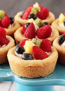 Fruit Cheesecake Sugar Cookie Cups on blue stand