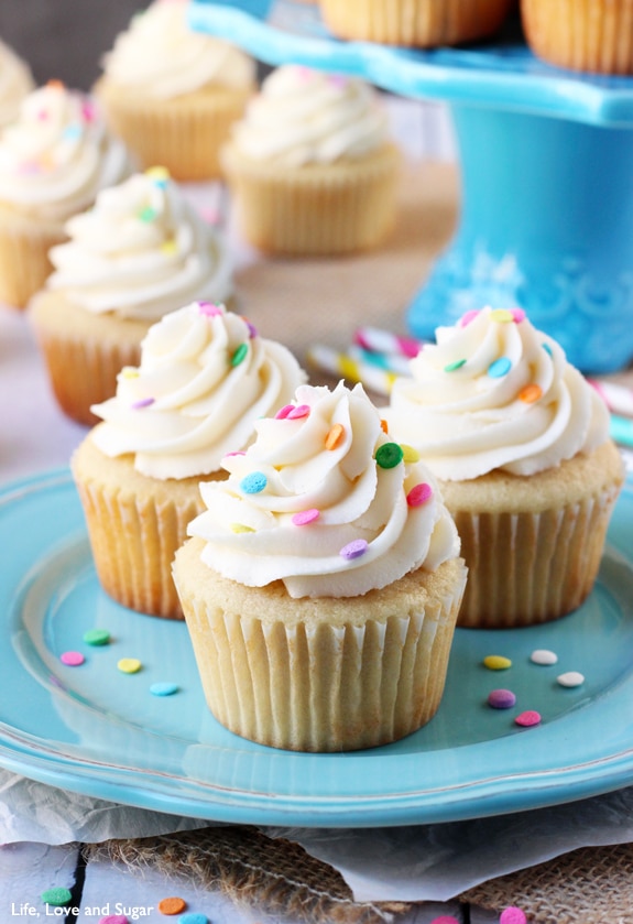 Perfect Moist Fluffy Vanilla Cupcakes on a blue plate