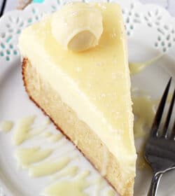 White Chocolate Truffle Cake slice on white plate overhead view