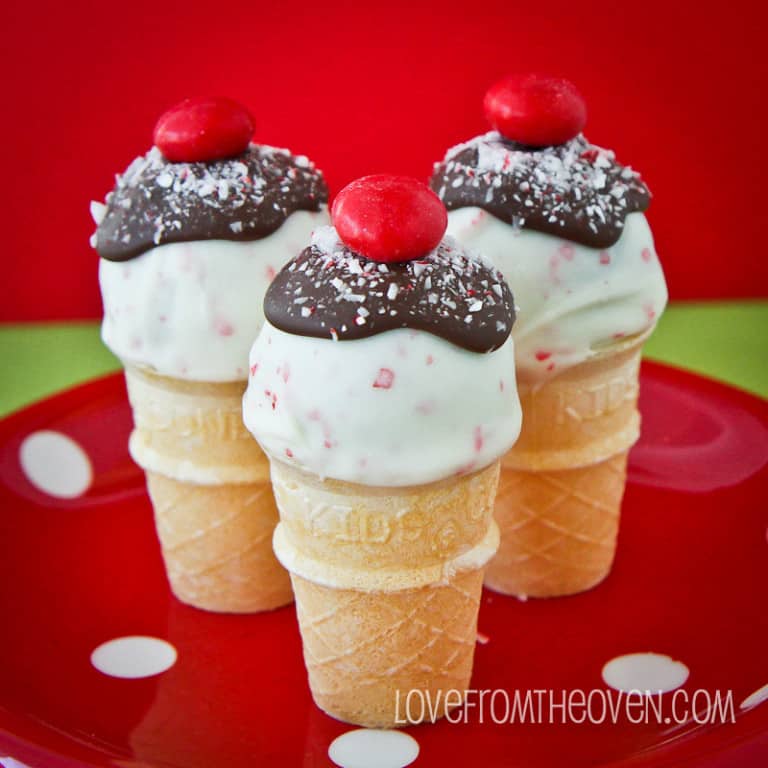 Three Candy Cane Oreo Truffle Cones on a polka dot plate. 