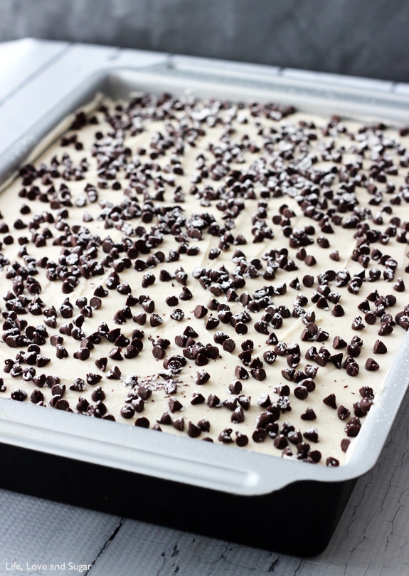 Cannoli Poke Cake - vanilla cake topped with cannoli filling icing!