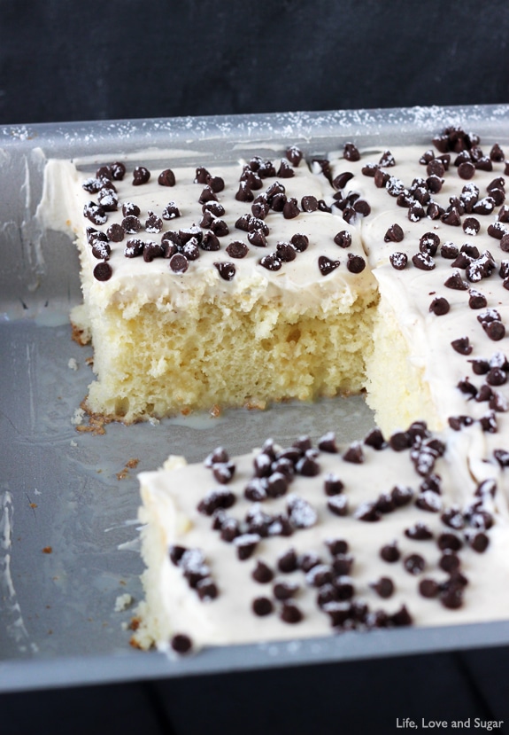 Cannoli Poke Cake - vanilla cake topped with cannoli filling icing!